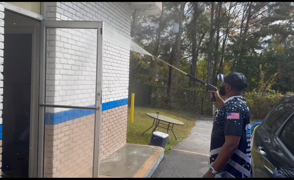 Timothy Dillon, owner of Pressure Boys USA, working on a commercial wash